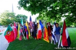 1. 多元文化节组委会成员展示各国国旗.jpg - 成都大学