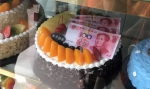 乐山惊现“百元大钞”蛋糕！已被责令下架并给予警告处罚 - Sichuan.Scol.Com.Cn